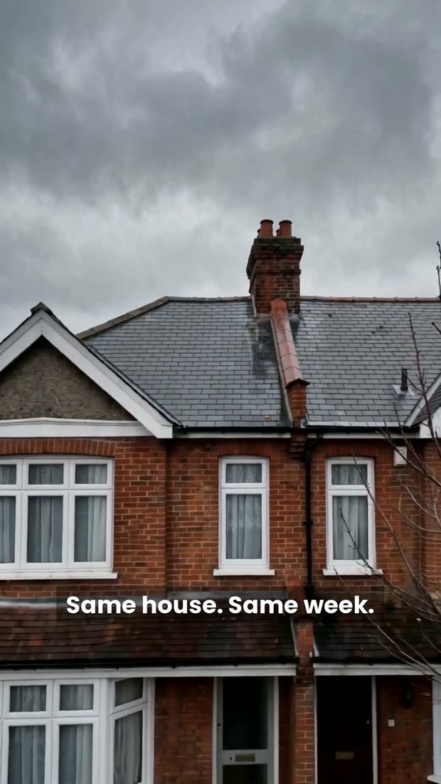 A red brick semi-detached house with a newly finished slate roof